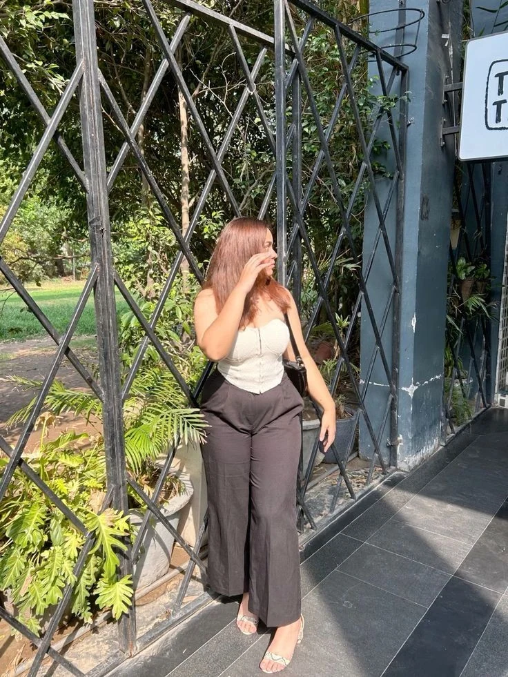 Cream Tank with High-Waisted Black Trousers