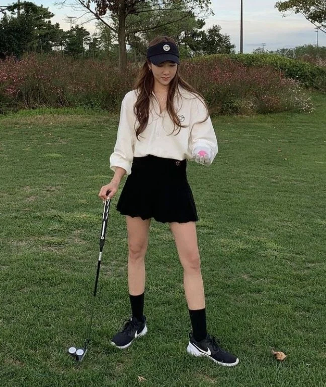 Cream Sweater with Black Skirt Elegance